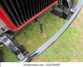 An Old Antique Car With A Hand Crank To Start 