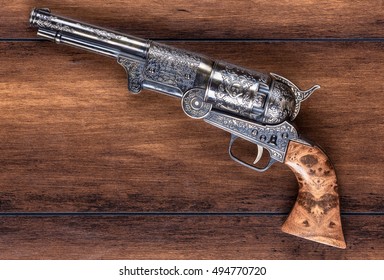 Old, Antique Gun On A Wooden Background