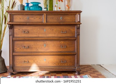 Old Antique Old Mahogany Chest Of Drawers In A Room With Additional Decor