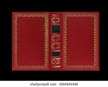 Old antique open book cover in red, green, black canvas and embossed golden decorations, isolated, XL size