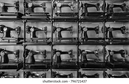 Old antique sewing machines. Background black and white pattern