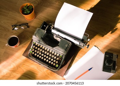 Old Antique Typewriter With Inserted Paper For Writing Articles And Books On The Desktop.