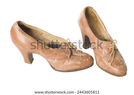 Old antique vintage traditional brown womans shoes the 19th century isolated on white background with clipping. Russia.