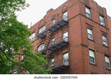 Old Apartment Buildings Exterior With Fire Ladder Outside          