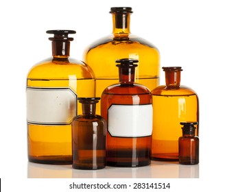 Old Apothecary Bottles Of Different Sizes Isolated On White Background