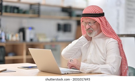 Old Arab Businessman With Laptop Having Neck Pain