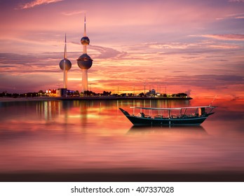 An Old Arabian Boat Docked In Front Of Kuwait Landmark 