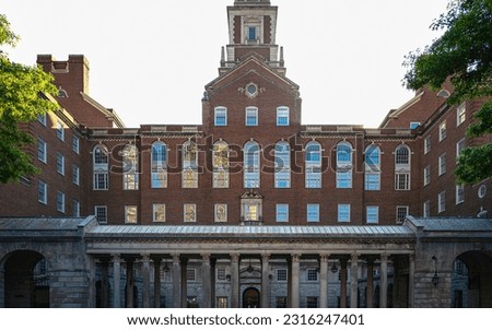 Old architecturally interesting red brick government building with the sun rising behind it in Providence, Rhode Island