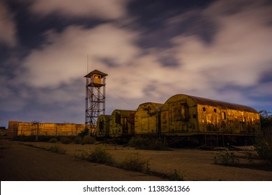 Old Army Watchtower In Abandoned Military Base At Night.