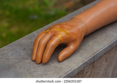 Old Artificial Hand On The Pavement Of The City Of Istanbul. Lost Plastic Limb On The Street. Old Forgotten Prosthetic Hand On The Road