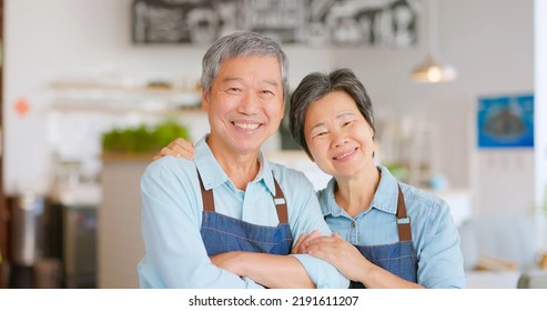 old asian couple smilimg happily in the coffee shop - Shutterstock ID 2191611207