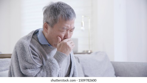 Old Asian Man Get A Cold And Cough At Home