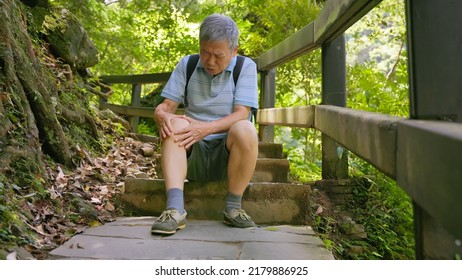 Old Asian Man Has A Hurtung Knee When Climbing Stairs