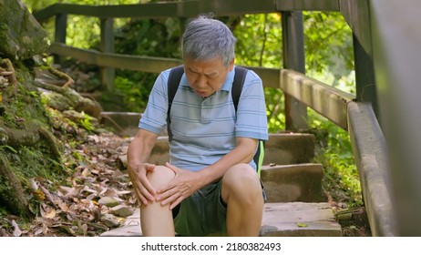 Old Asian Man Has A Hurtung Knee When Climbing Stairs