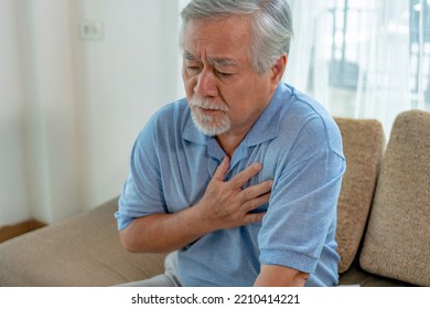 Old asian man having heart attack chest pain, Health problems medical concept. - Powered by Shutterstock