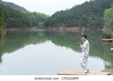 An Old Asian Man Punching Tai Chi