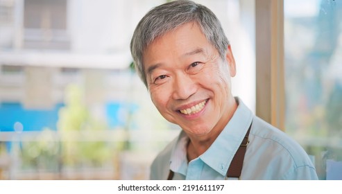 Old Asian Man Wecomimg Customers At Front Door In Cafe Or Restaurant