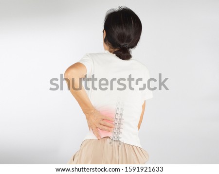 old asian woman feel spine bones pain , bone degeneration