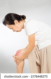 Old Asian Woman Touch Knee Bones Pain	
