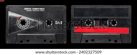 Old audio cassette tape collection with blank label. black and red