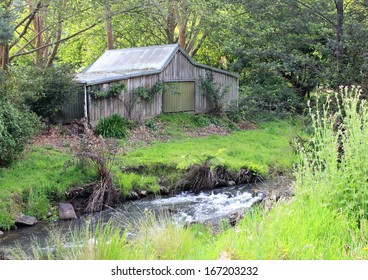 Old Australian Farm Shed In Bush Setting On River Frontage