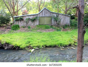 Old Australian Farm Shed In Bush Setting On River Frontage