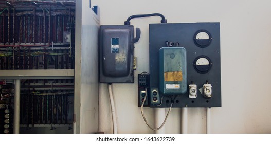 Old Automatic Electrical Power Safety Switch Breaker ,Old Controlled Power System.hanging With  White Wall Background Connect The Switchboard Server Room Of The Data Center.