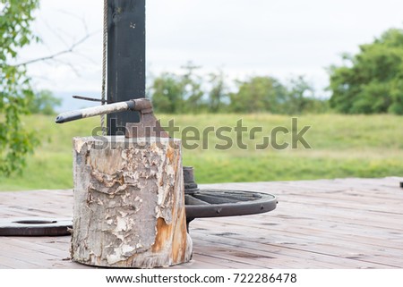 An old axe next to Medieval gallows