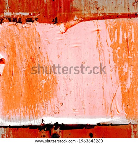 Old Background Texture From Grunge Ripped Torn Posters and Ads . Exposed Weathered Urban Wall with Torn Street Posters, Paper and Stickers. Ripped Street Poster Background.