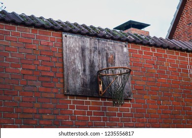 Old Backyard Basketball Net On Brick Wall