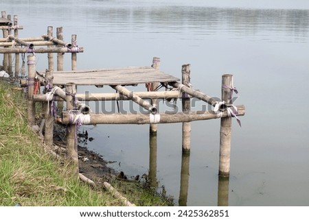 Old bamboo and wood made fishing platform. fishing lake of Bangladesh.