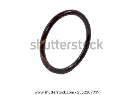 old bangle bracelet has brown wooden pattern isolated on white background,vintage and retro,macro  photo,has path