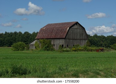 old barn in field