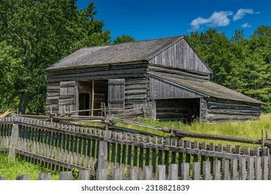 An old barn in the field with fences in Ontario Canada - Powered by Shutterstock