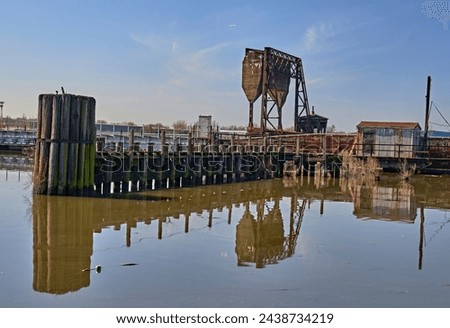 An old bascule railroad bridge,also known as a drawbridge or a lifting bridge, with a counterweight. To provide clearance for boat traffic. Over Overpeck Creek in N.J.entrance to the Hackensack River