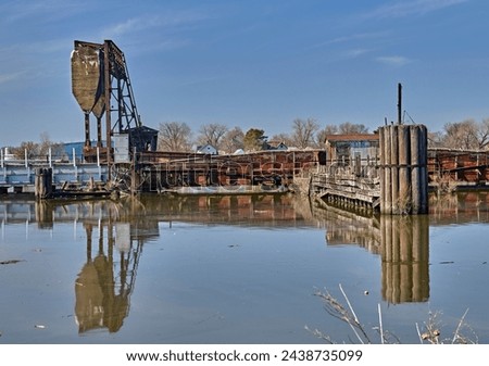 An old bascule railroad bridge,also known as a drawbridge or a lifting bridge, with a counterweight. To provide clearance for boat traffic. Over Overpeck Creek in N.J.entrance to the Hackensack River.