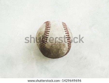 Old baseball dirty and used for sports game, shows detail of single ball close up.