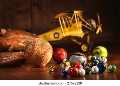 Old Baseball And Glove With Antique Toys On Wood Floor