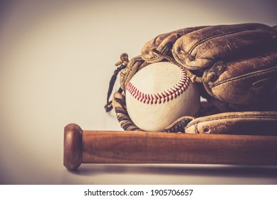 Old Baseball Glove With Ball And Bat