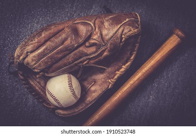 Old Baseball Glove With Ball And Bat