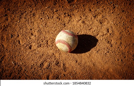  Old Baseball On Infield Dirt                              