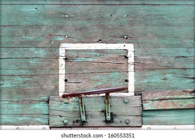  Old basketball basket on weathered wooden facade