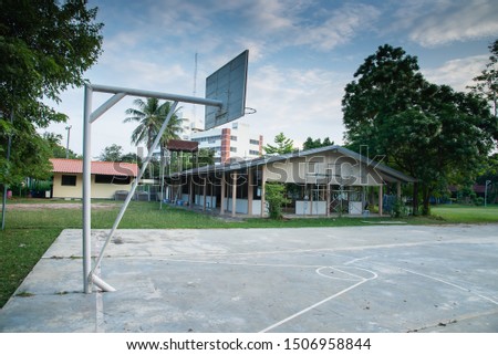 old basketball court outdoor in the evening