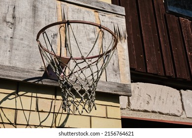 Old Basketball Net Isolated On An Old Building