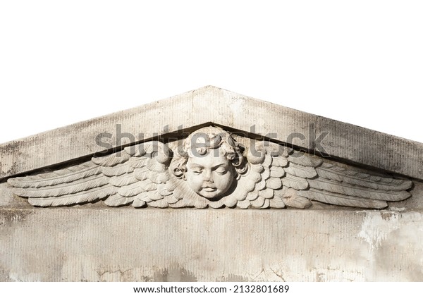 An old bas-relief of the angel with child\'s face\
spreading his wings