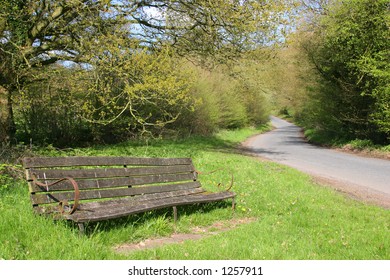 Old Bench By Side Of Country Lane In Worcestershire UK