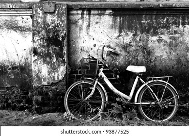Old bicycle and brick wall