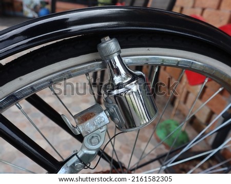 old bicycle dynamo. When the bicycle wheel rotates, it can turn on the bicycle light.