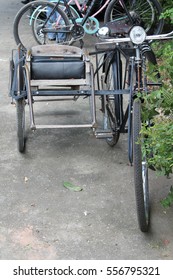 Old Bicycle Sidecar Parking On Concrete Floor.