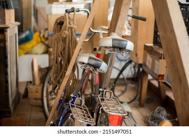 Old Bicycles In A Cluttered Garage. Close-up